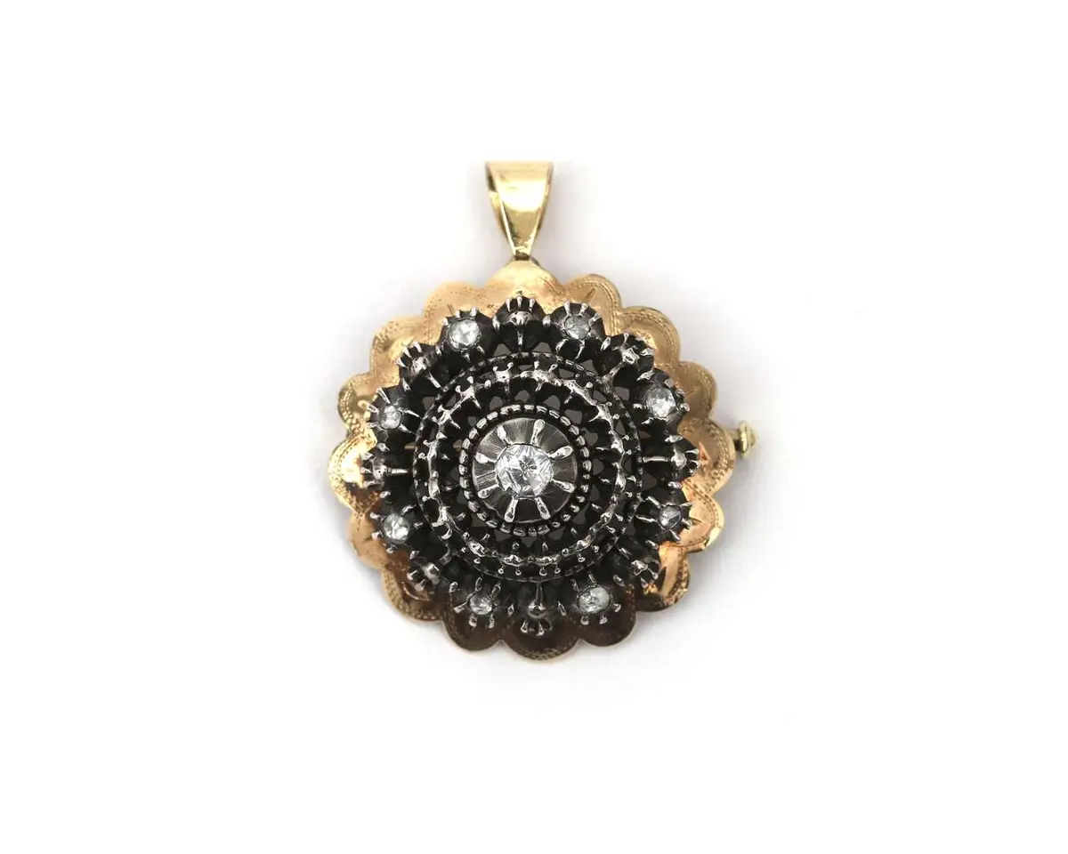 A 14k yellow gold and silver brooch/pendant set with rose-cut diamonds