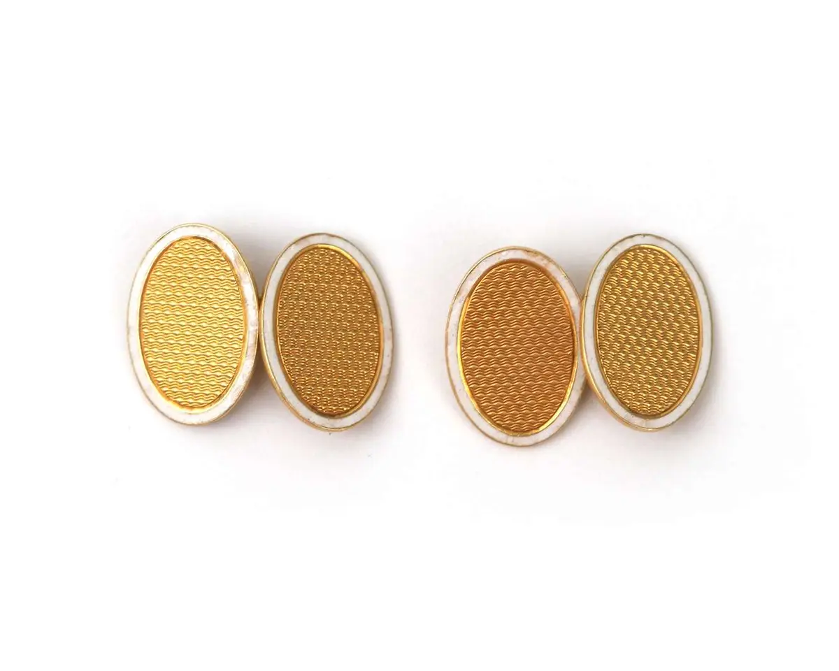 A pair of 18k yellow gold cufflinks with white enamel, 1920s