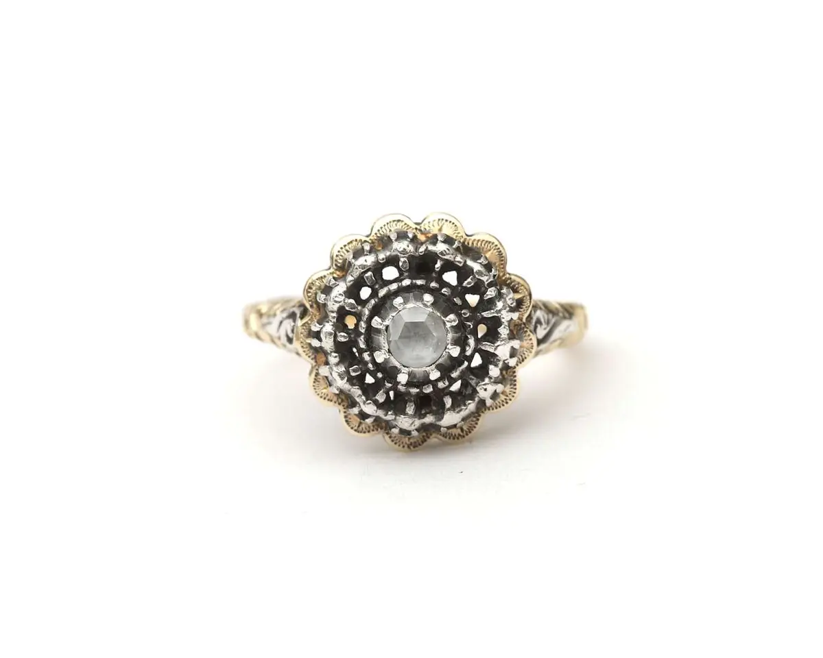 A 14k yellow gold and silver ring set with a rose-cut diamond