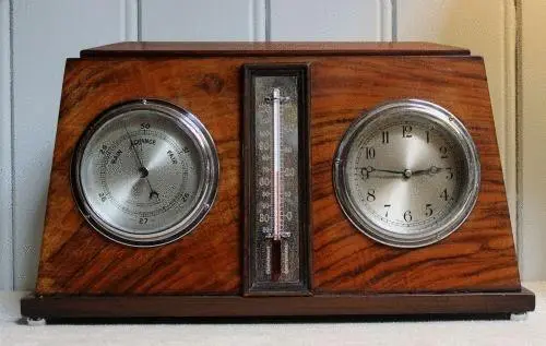 Clock, thermometer and barometer combination