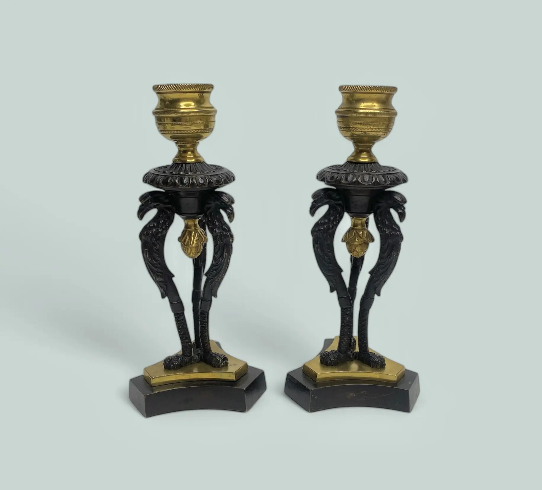 Pair Regency ormolu Griffin candlesticks, c. 1820.