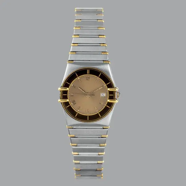 Constellation in acciaio con inserti dorati e bracciale integrato