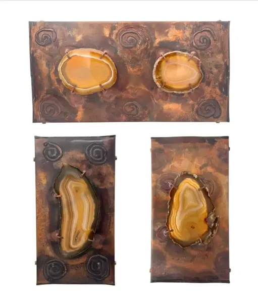 A set of three unusual 1970s copper and agate wall lights with one