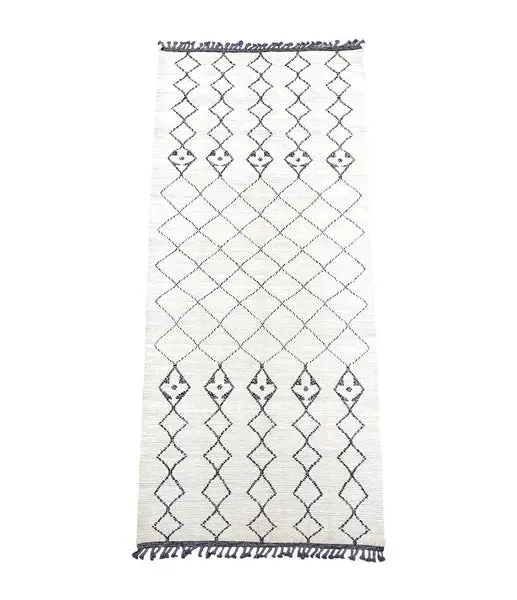 A large handwoven Moroccan Beni Ourain wool berber rug with tribal