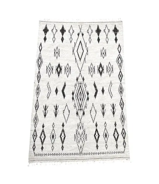 A vintage handwoven Moroccan berber rug, with tribal diamond and line