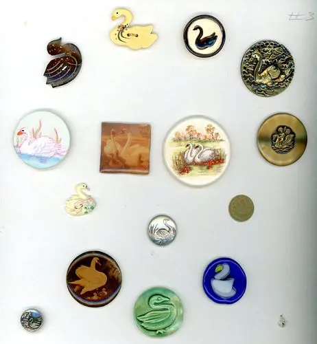 A CARD OF DIVISION THREE SWAN BUTTONS