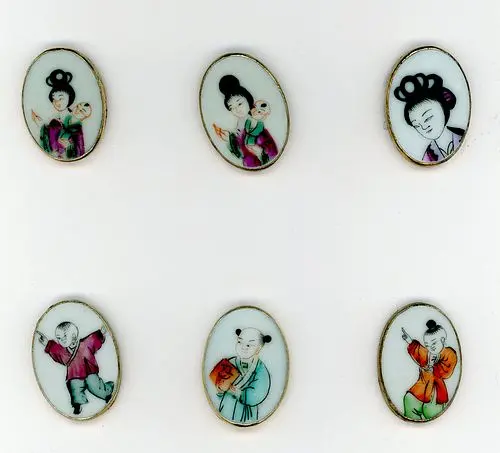 A CARD OF DIVISION THREE CERAMIC BUTTONS