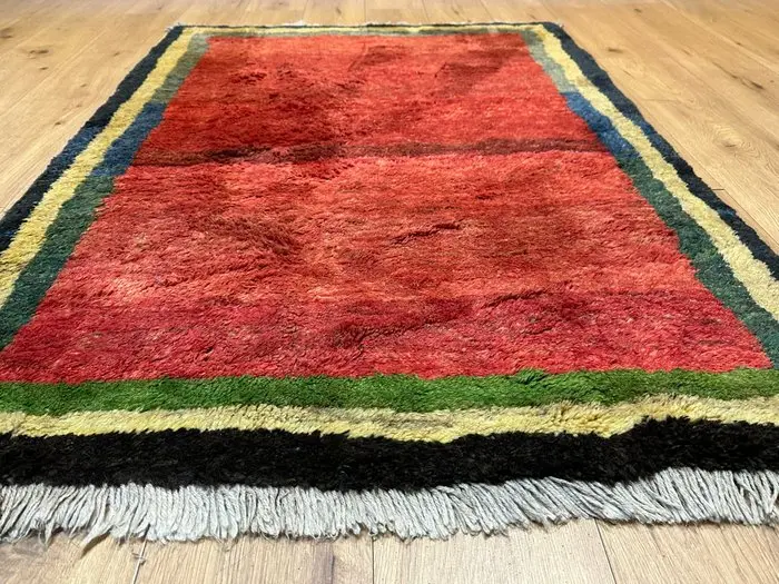 Beautiful Gabbeh rug with a rich field and a multicolored
