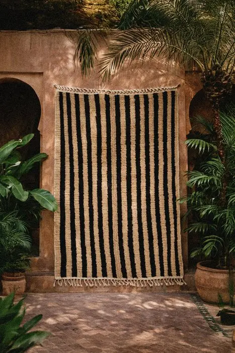 Handmade Amazigh Berber Beni Ourain rug with a striped pattern
