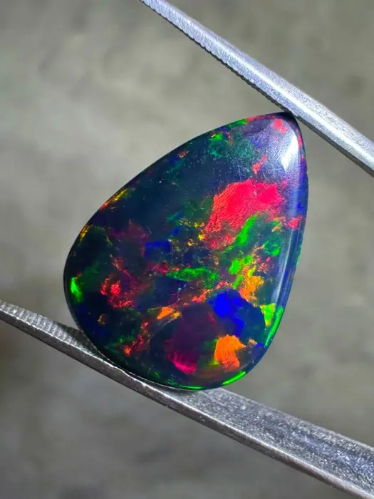 Top quality! Ethiopian black opal. 8.65 carats. pear-shaped cabochon- 1.73 g
