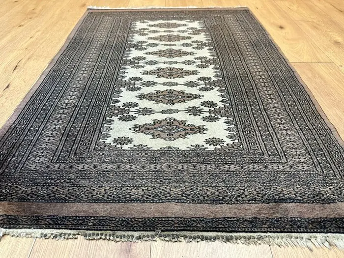 Hand-knotted Pakistan Bokhara Oriental rug with a classic...