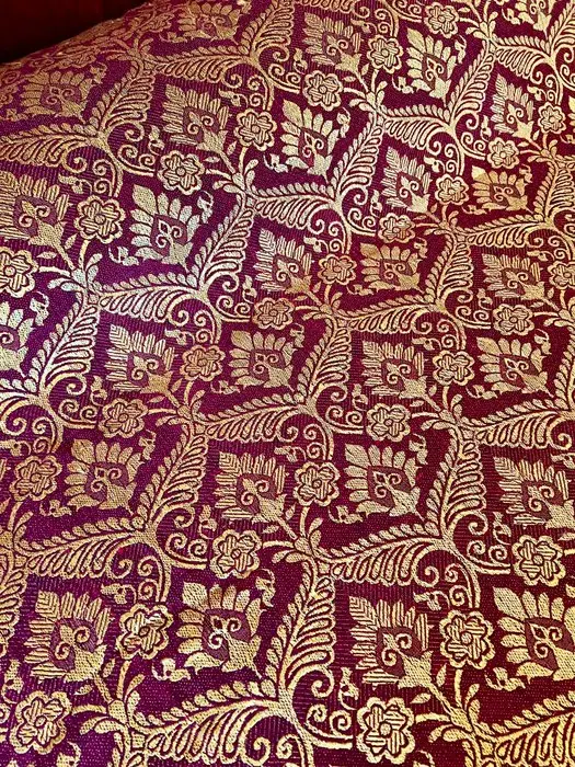 Antique gold-plaid quilt on burgundy