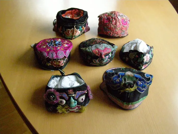 Seven traditional tribal hats or headdresses