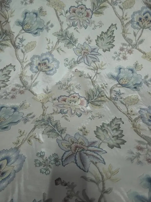 Wonderful floral fabric with a pearlescent beige moiré background