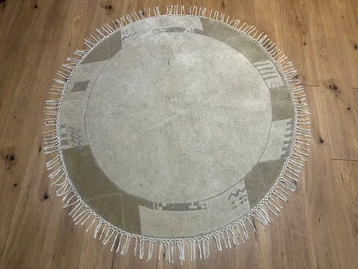 Modern Nepal rug - round hand-knotted artwork with...