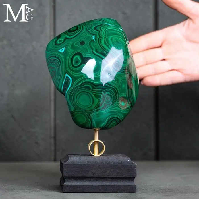 Bright green malachite with hypnotic concentric bands...