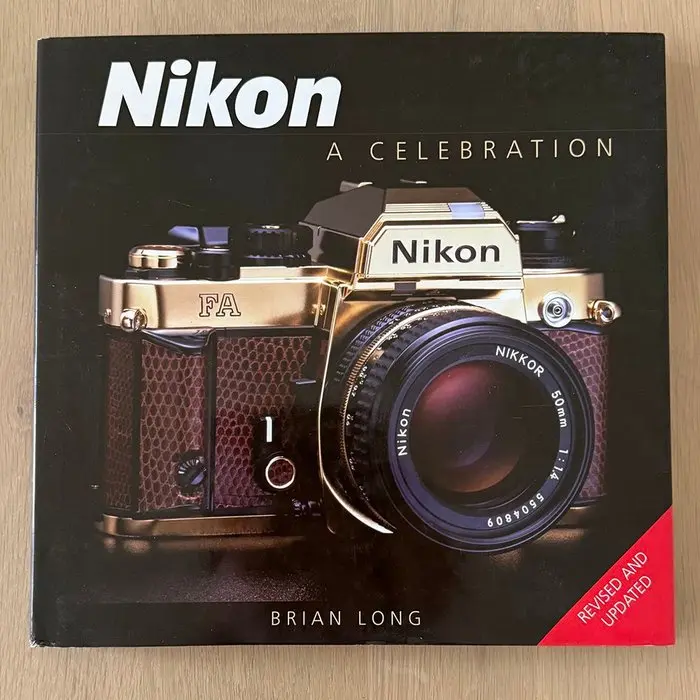 Nikon a celebration door Brian Long . Analogue camera