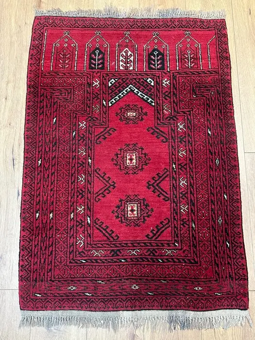 Hand-knotted Oriental prayer rug in the traditional...