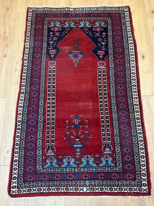 Hand-knotted Oriental rug with a mihrab and floral...