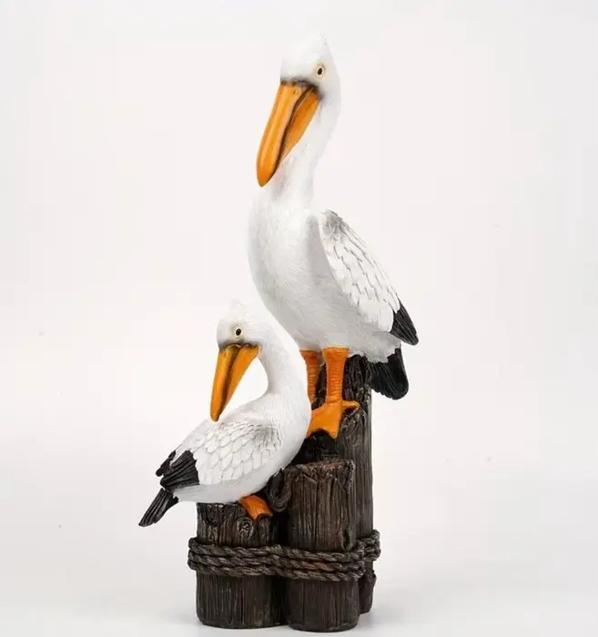 Unknown - Figure - Pair of pelicans on wooden posts - Resin