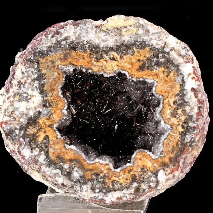Prismatic-acicular black Goethite in Quartz geode in a...