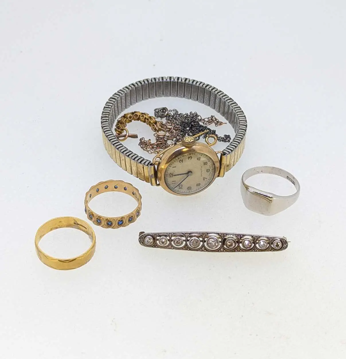 A hallmarked 18ct gold ring and a diamond set brooch...