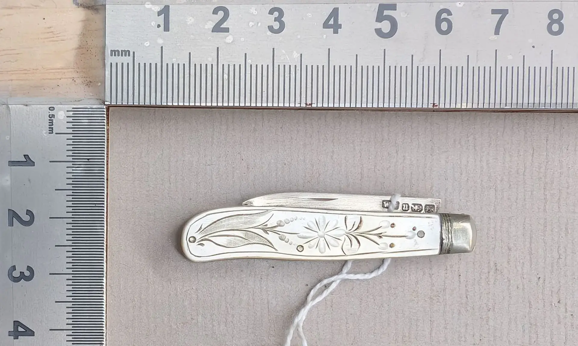 1 antique fruit knife with a silver blade and mother-of-pearl handle—see