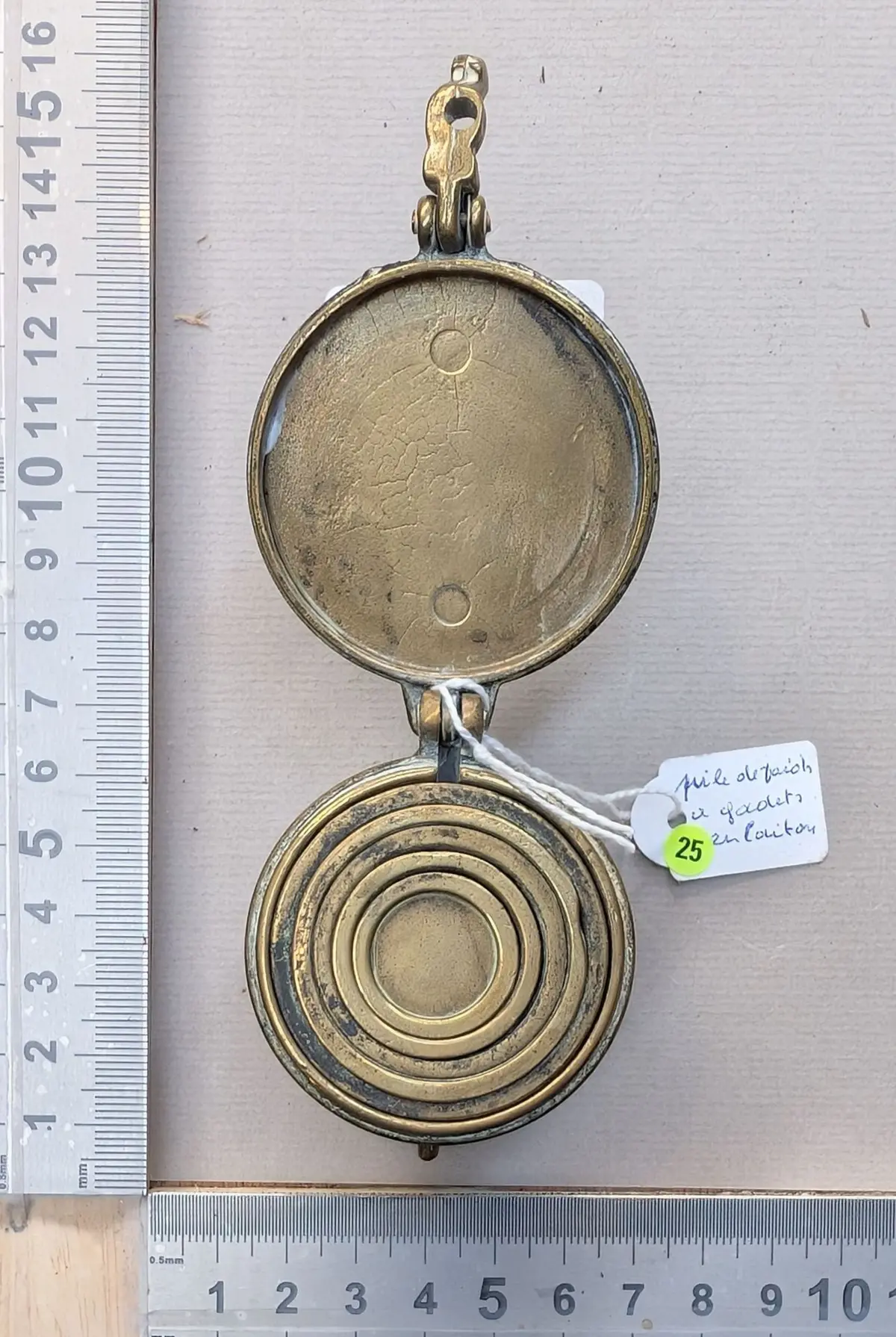 Stack of brass cup weights—see photos for dimensions and condition