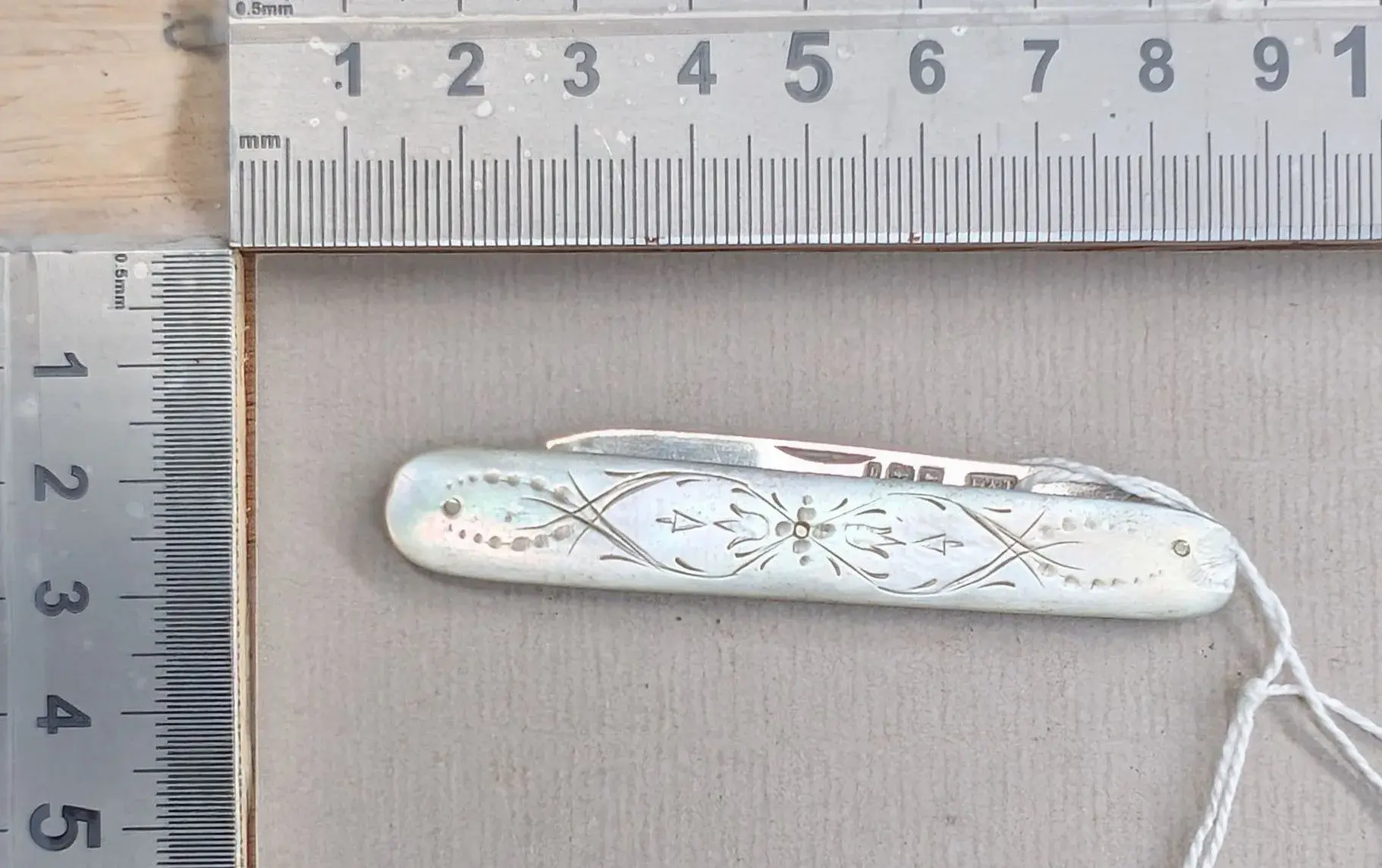 1 antique fruit knife with a silver blade and mother-of-pearl handle—see