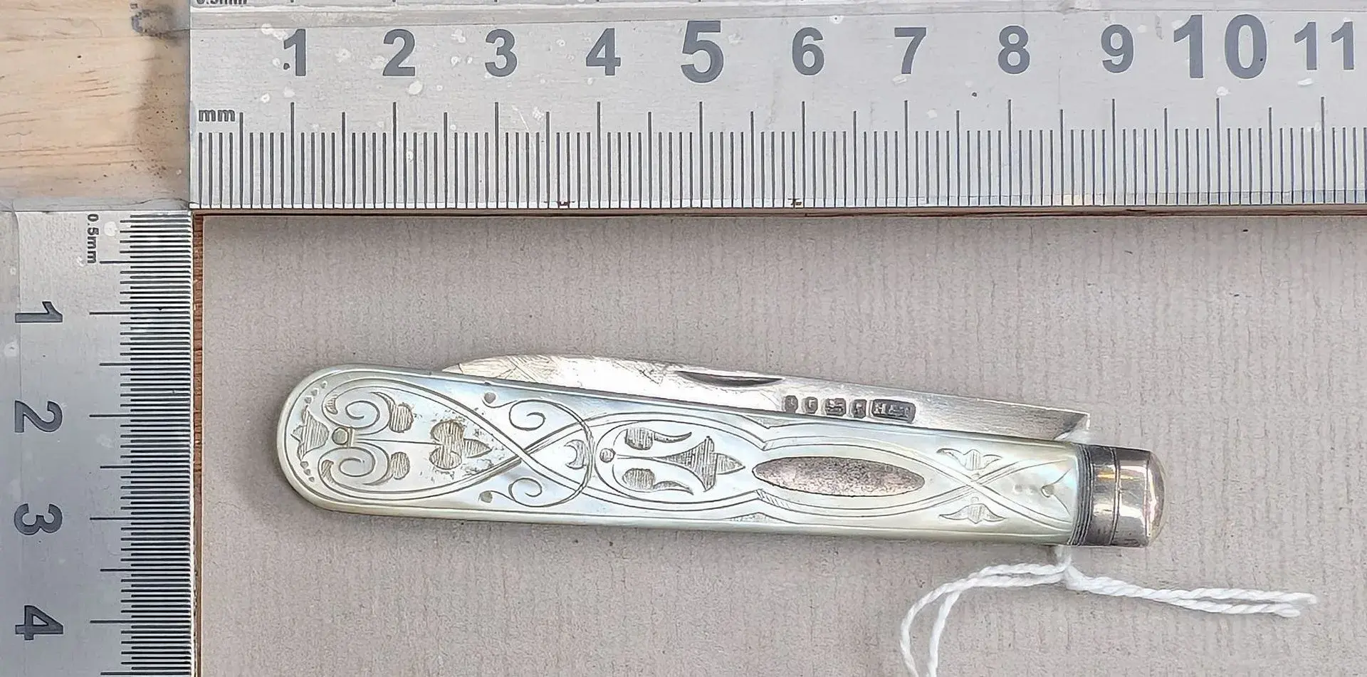 1 antique fruit knife with a silver blade and mother-of-pearl handle—see