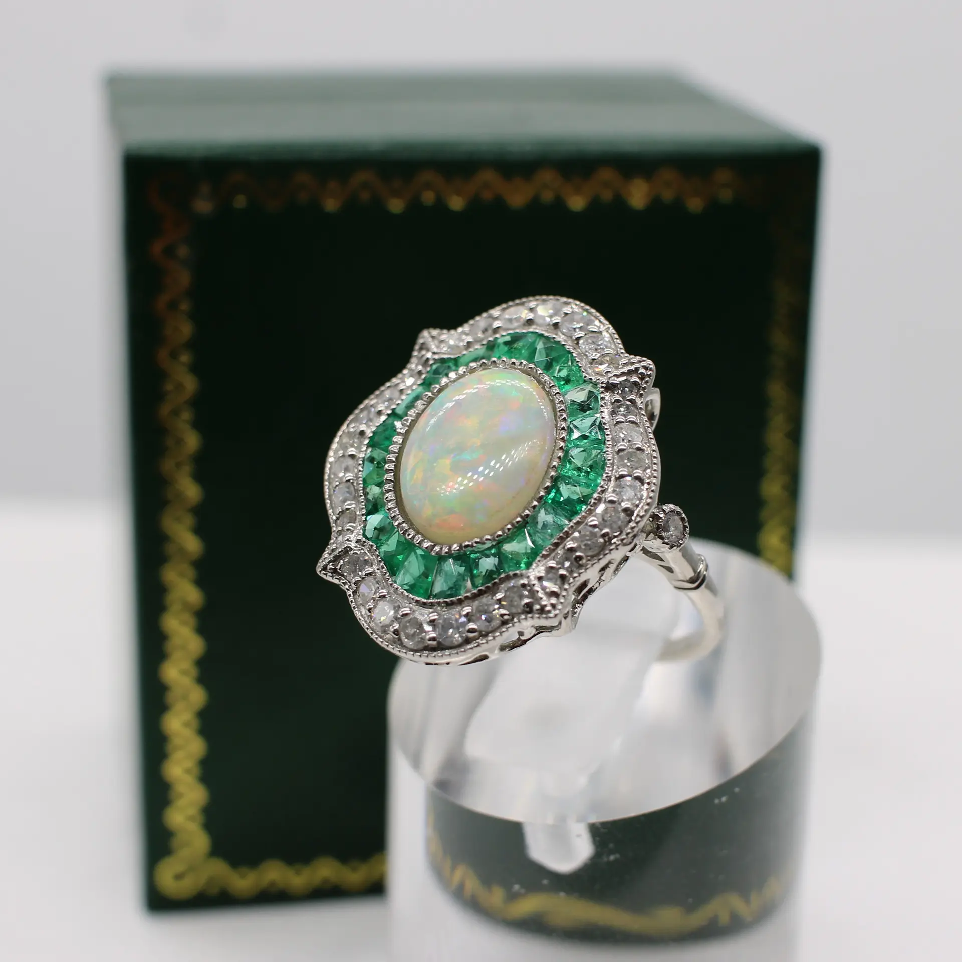 EMERALD, DIAMOND & OPAL RING.