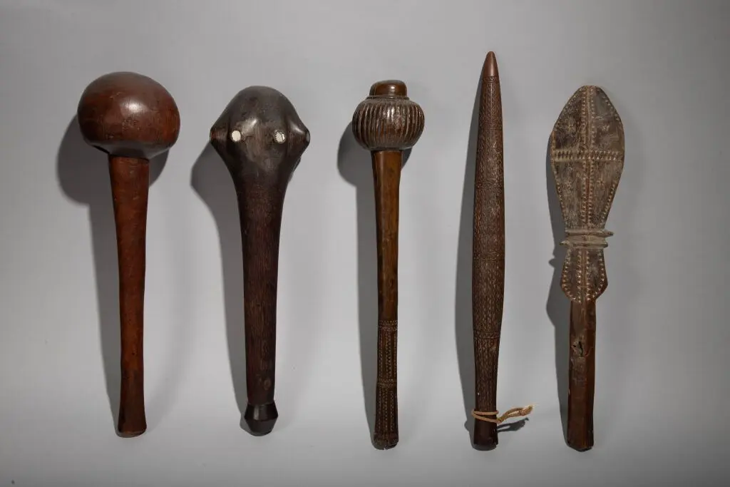 Club with a head inlaid with mother-of-pearl discs. Rennell Islands
