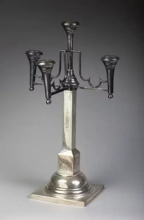 A large four-arm candelabra made of 800‰ silver. The quadrangular