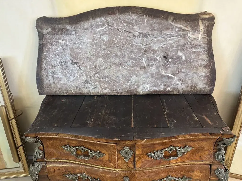 A curved chest of drawers with a tomb-like shape on all sides, made