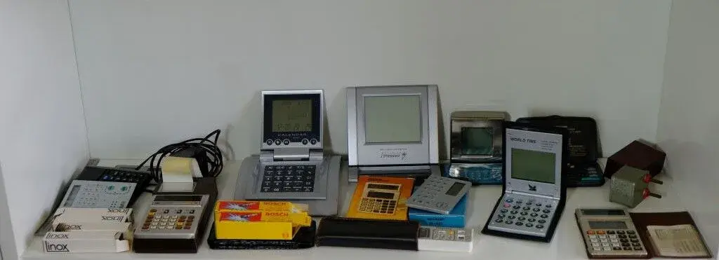 Collection of small solar-powered or battery-operated calculators