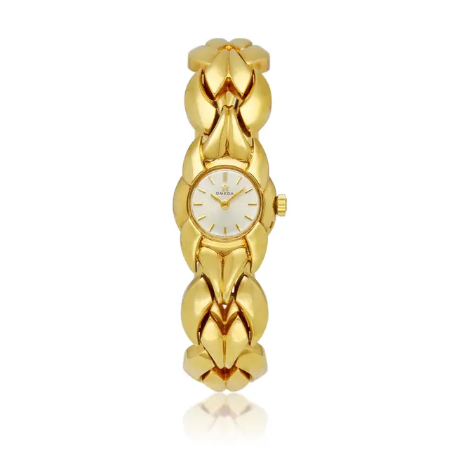 Omega; A gold bracelet watch with original certificate. Circa 1970