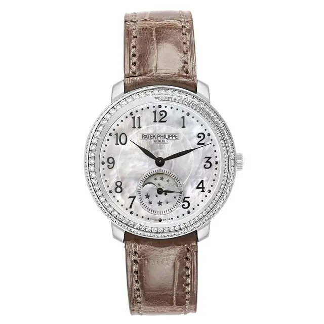 Complications (Reference 4968G-010). A 33mm white gold diamond-set