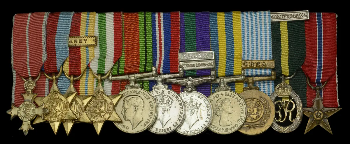 A post-War O.B.E. mounted group of eleven miniature dress medals attributed