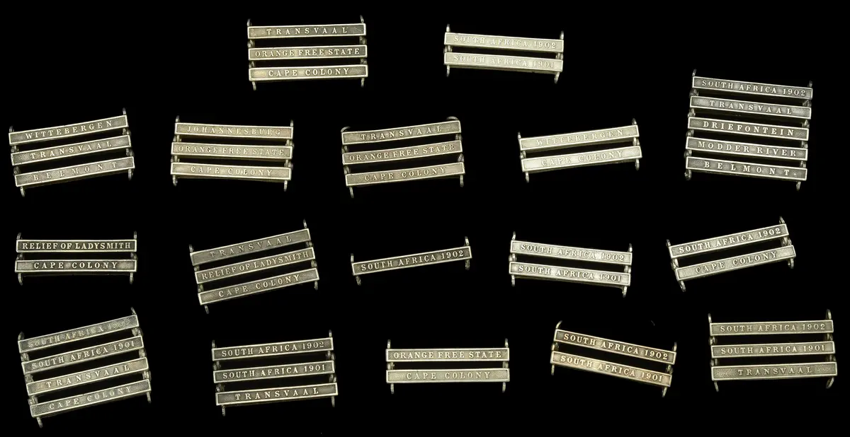 Clasps: A selection of clasps for the Queen’s South Africa Medal