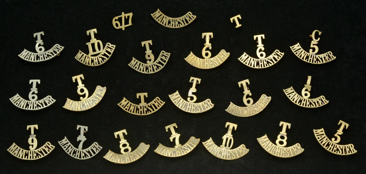 Manchester Regiment, Assorted Shoulder Titles. A good selection with