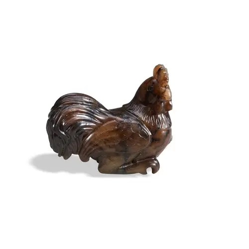 A MOTTLED-BROWN JADE FIGURE OF A COCKEREL OR ROOSTER QING DY...