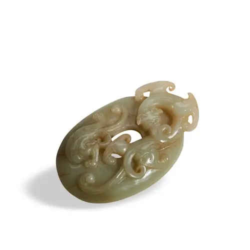 A FINE CELADON AND RUSSET JADE 'CHILONG' PENDANT QING DYNAST...