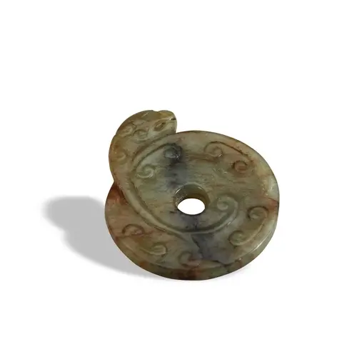 A MOTTLED-CELADON JADE 'DRAGON' PENDANT MING DYNASTY (1368-1...