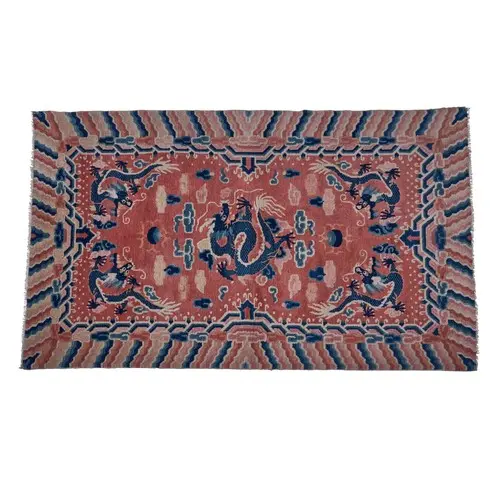 A GOOD, PROBABLY IMPERIAL, CHINESE PINK-GROUND DRAGON CARPET...