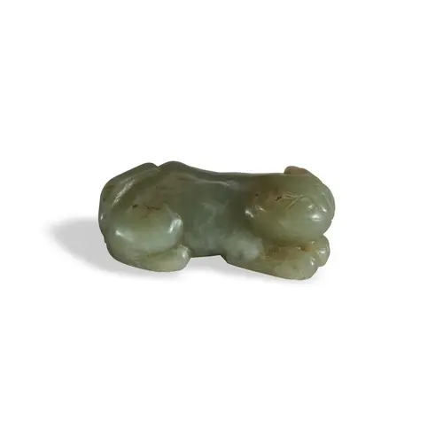 A CELADON JADE CARVING OF A LION QING DYNASTY (1644-1911) 青白...