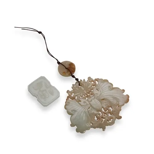 TWO CARVED JADE PENDANTS 19TH / 20TH CENTURY 蝶形玉佩及牌 十九/二十世纪...