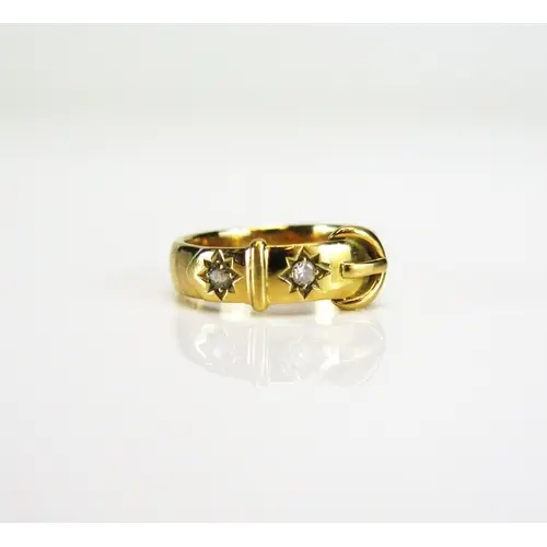 A Victorian buckle ring set with two European cut diamonds i...