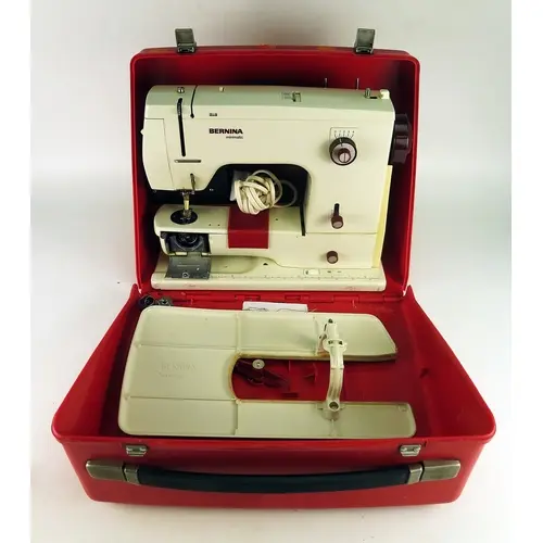 A Bernina Minimatic electric sewing machine, contained in it...