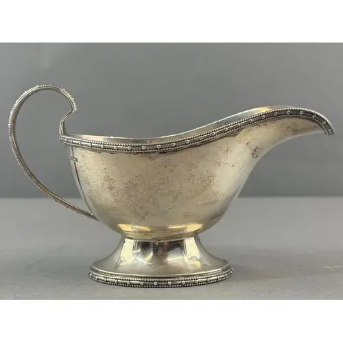 Silver: a pedestal sauce boat by Walker & Hall, Sheffiel...