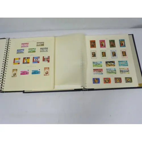 Two vintage stamp albums to include Antigua and West Indies/...